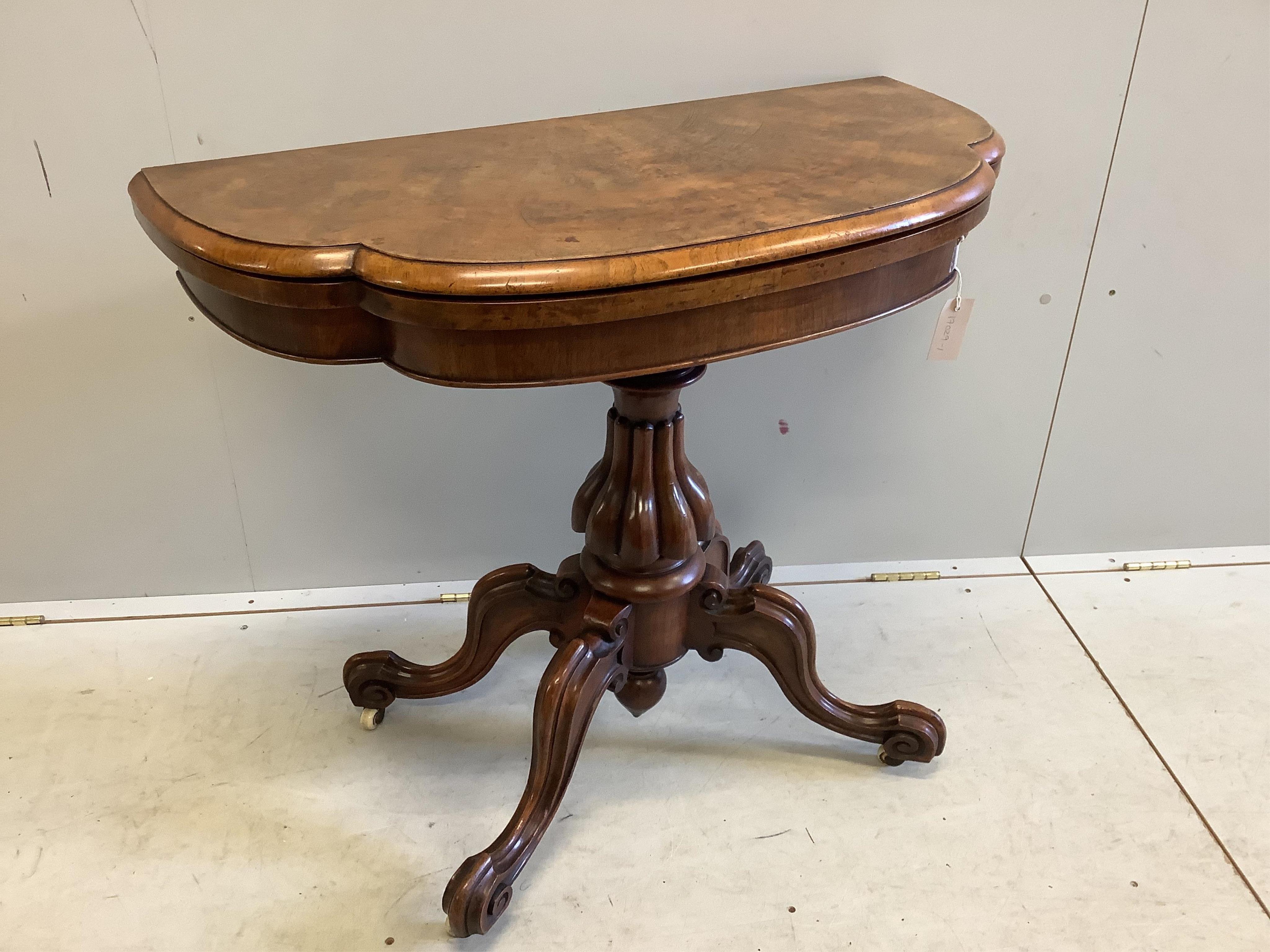 A Victoria figured walnut folding card table, width 91cm, depth 45cm, height 76cm. Condition - fair